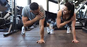 Toning Bingo Wings: Your Ultimate Guide to Sculpting Sleek Arms at the Gym 3 Fitness trainer demonstrating arm toning exercises Chesterfield