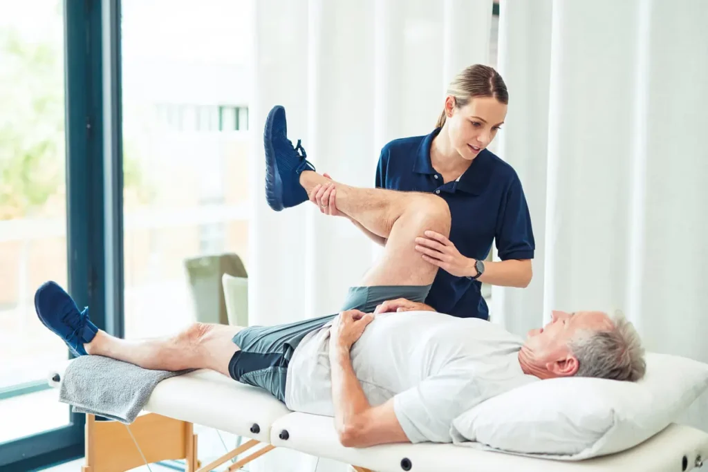 Revitalising Recovery: Effective Rehabilitation Strategies for Muscle Injuries 3 Physiotherapist assisting a patient with muscle recovery exercises Chesterfield